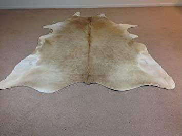 BUTTER CREAM AND WHITE COWHIDE RUG